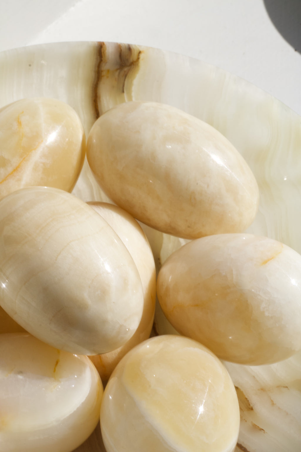 Carved Stone Eggs in Onyx Bowl